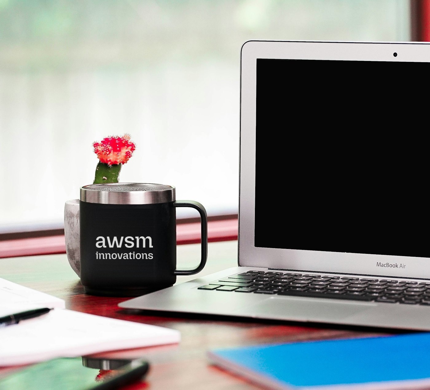 Laptop and a coffee mug on a desk