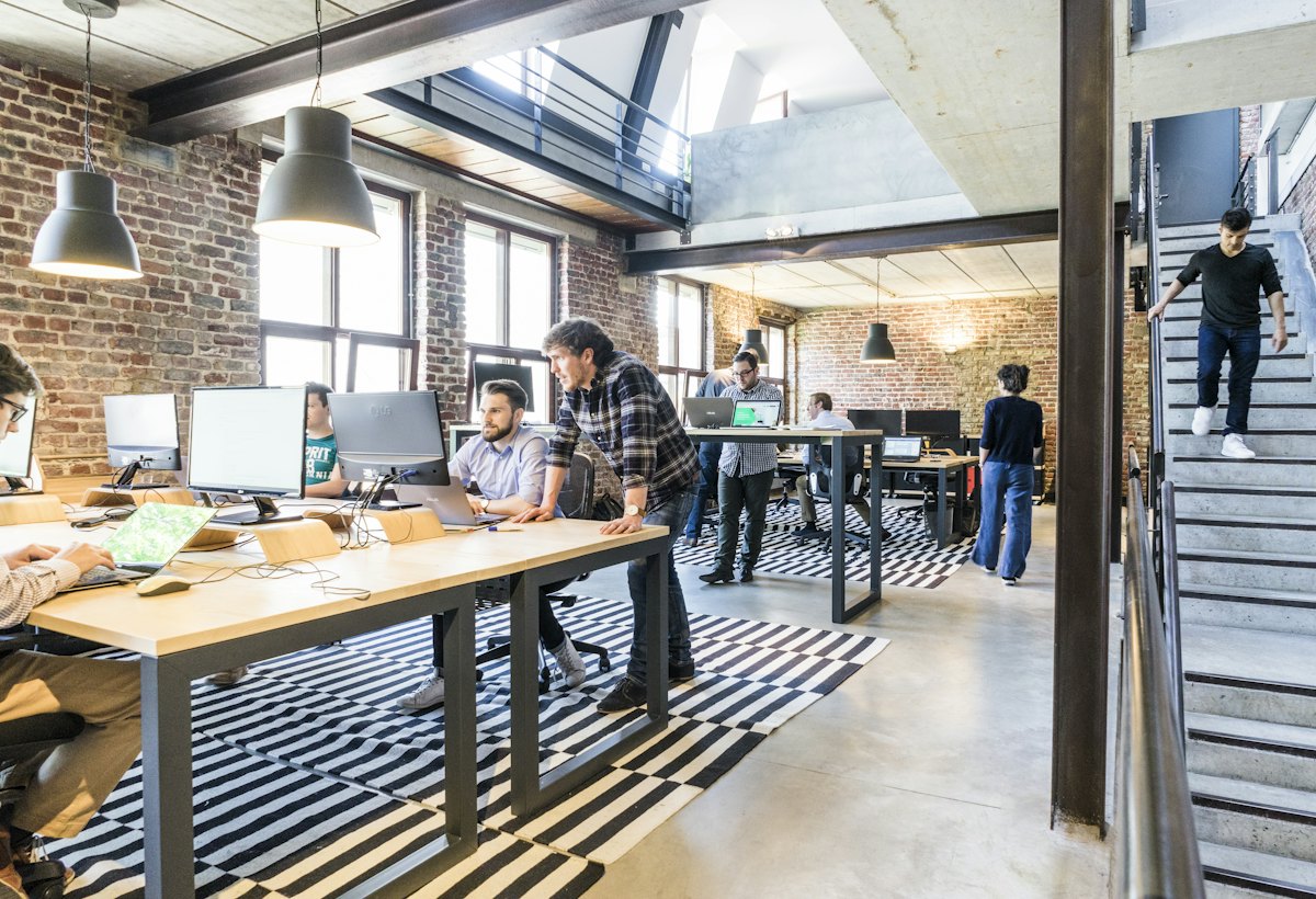 Team working together at desks in a bright office