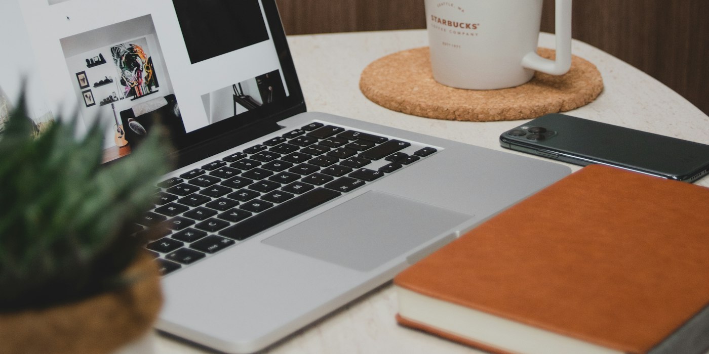 Laptop and a coffee mug on a desk